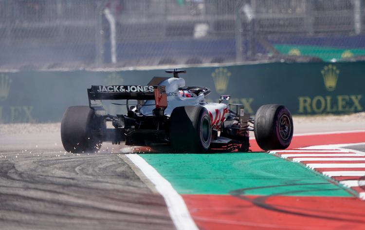 Kevin Magnussen blev opfordret til at give den lidt for meget gas i det amerikanske grandprix, og så blev han diskvalificeret. Darren Abate/AP