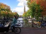 Amsterdam er fortsat en af de storbyer i Europa, hvor folk valfarter til som turister. Både med tog og fly. Margriet Faber/AP
