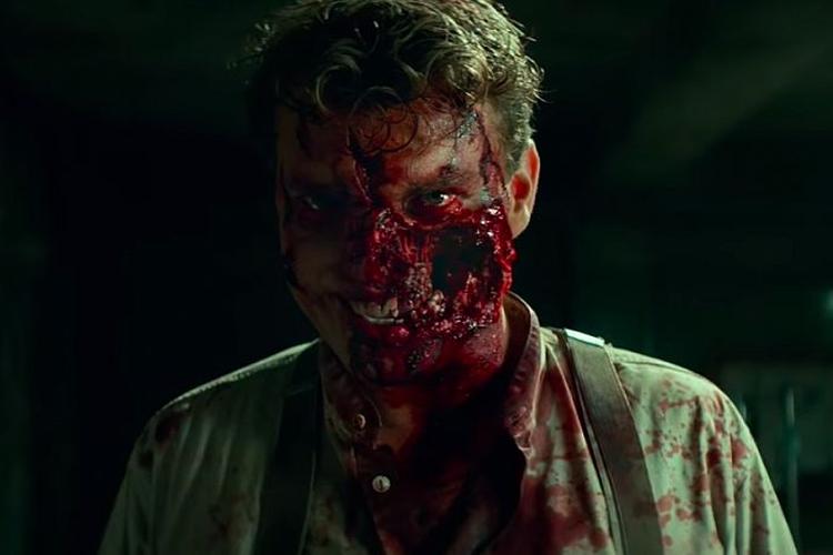 Pilou Asbæks ansigt ligner vrangen på en blodappelsin i 'Overlord'. Pressefoto