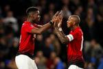 Paul Pogba (tv. sammen med Ashley Young) lagde op til det første mål mod Chelsea og var med i opspillet til det andet, som han selv scorede. Foto: John Sibley/Ritzau Scanpix