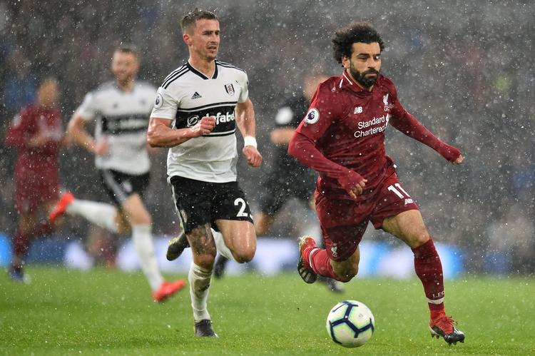 Mohamed Salah (t.h.)  og Liverpool er på jagt efter mesterskabet.  Foto: Glyn Kirk/Ritzau Scanpix