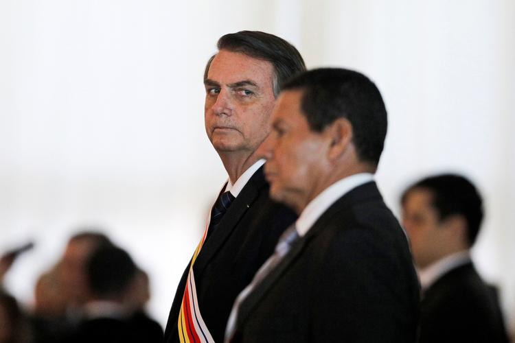 Jair Bolsonaro, der selv er tidligere kaptajn i hæren og hører til på den yderste højrefløj, har flere gange før taget de militære magthavere i forsvar. Det kup, der 31. marts 1964 afsatte en venstreorienteret præsident, har han kaldt en triumf og et storslået anslag mod kommunismen. (Photo by Sergio LIMA / AFP)
   Foto: Sergio Lima/Ritzau Scanpix