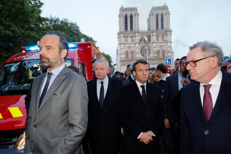 Den franske præsident, Emmanuel Macron, foran Notre Dame. Foto: Philippe Wojazer/Ritzau Scanpix