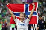 Ada Hegerberg med det norske flag efter årets Champions 
League-finale, hvor hun scorede hattrick. Hun savner landsholdet, men ikke det norske forbund. Foto: Lisi Niesner/Ritzau Scanpix