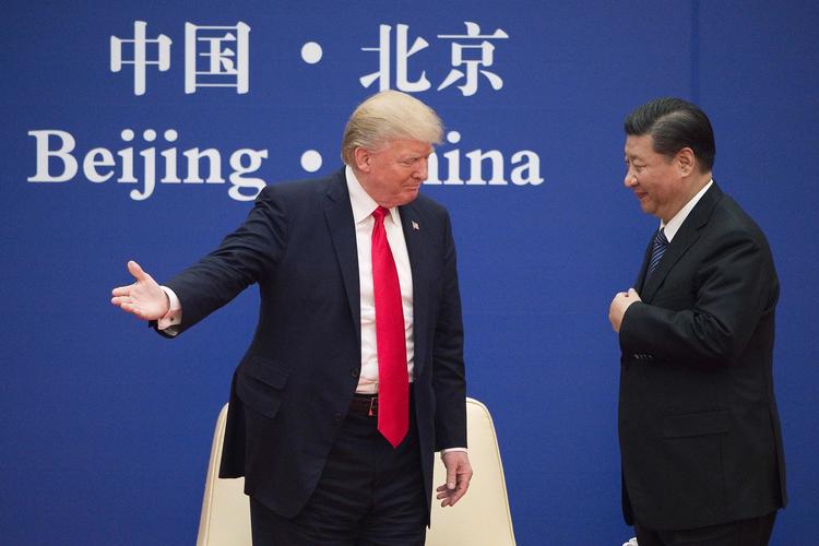 USA's præsident, Donald Trump, og hans kinesiske kollega, Xi Jinping, da de mødtes sidste år i novemberi i Beijing. Foto: Nicolas Asfouri/Ritzau Scanpix