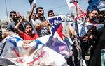 Palæstinensisk demonstration i Khan Yunis i Gaza-striben mod den amerikanske fredskonference i Bahrain, der opfattes som et amerikansk forsøg på bestikke palæstinensere til at acceptere fortsat israelsk besættelse af palæstinensiske områder.
   Foto: Said Khatib/Ritzau Scanpix