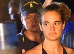 Indbyggere på Lampedusa råbte skældsord efter Carola Rackete, mens andre hyldede hende, da hun bevogtet af politi gik fra borde lørdag. Italien bruger dramaet til at true med at smadre Dublin-aftalen. Foto: 

Carola Rackete, the 31-year-old Sea-Watch 3 captain, is escorted off the ship by police and taken away for questioning, in Lampedusa, Italy June 29, 2019. REUTERS/Guglielmo Mangiapane Foto: Guglielmo Mangiapane/Ritzau Scanpix