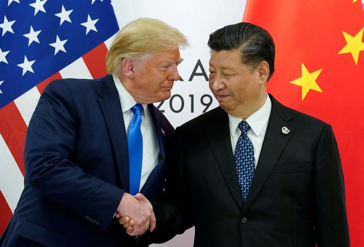 USA's præsident, Donald Trump, sammen med Kinas ditto, Xi Jinping, ved G20-topmødet i dag.  Foto: Kevin Lamarque/Ritzau Scanpix