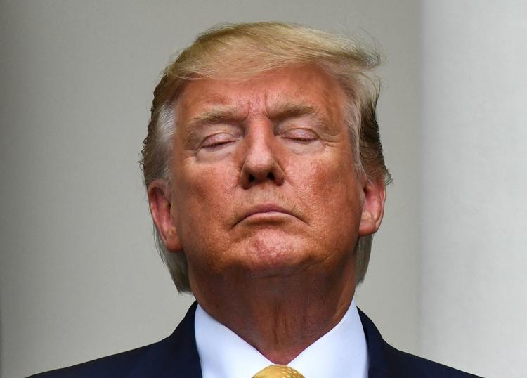 Donald Trump i går efter at han har holdt pressemøde om sagen foran Det Hvide Hus.  Foto: Nicholas Kamm/Ritzau Scanpix
