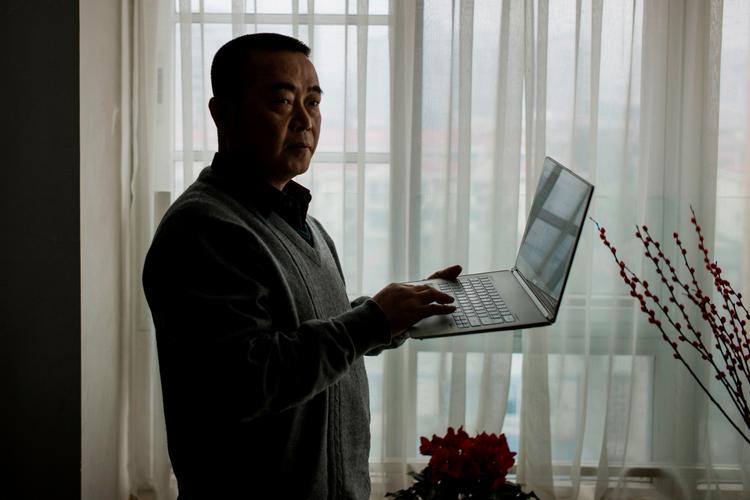 Huang Qi har været løbende inde og ude (mest inde) af fængslet siden 2003, hvor han blev dømt for internetkriminalitet.    Foto: Fred Dufour/Ritzau Scanpix
