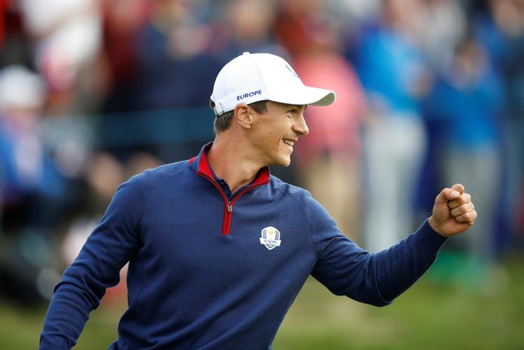 Smilet og kasketten er to af Thorbjørn Olesens varemærker. Her er det fra Ryder Cup-matchen sidste år mellem Europa og USA, som det europæiske hold vandt. Foto: Carl Recine/Ritzau Scanpix