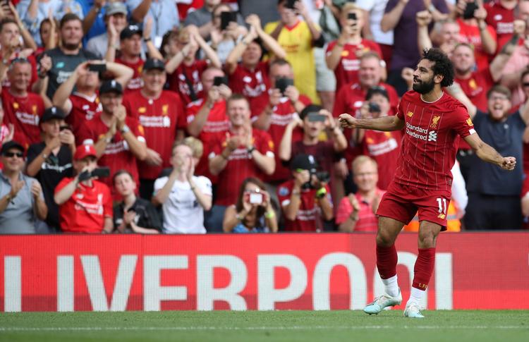 
    Mohamed Salah scorede to af målene for Liverpool, der med sejren bevarer førstepladsen foran Arsenal, som er toer før de resterende kampe i runden. Reuters/Carl Recine  Foto: Carl Recine/Ritzau Scanpix