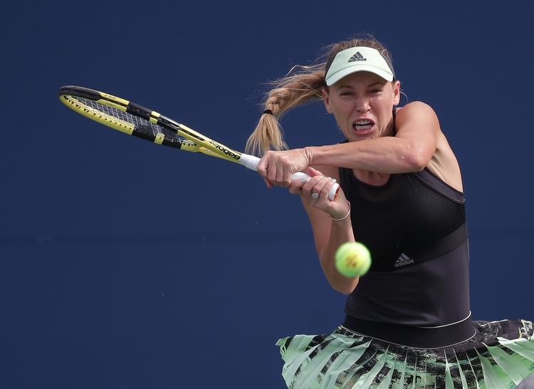 Caroline Wozniacki måtte grave dybt, da hun tirsdag aften og natten til onsdag spillede sig videre til 2. runde af US Open.  
   Foto: Jerry Lai/Ritzau Scanpix