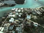 Kun få huse i dette kvarter på Bahamas er ikke blevet revet omkuld af orkanen Dorian. Ifølge de lokale myndigheder står op mod tre ud af fire huse under vand.
   Foto: Michelle Cove/trans Island Airwa/Ritzau Scanpix