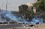 Demonstranter samlets i Bagdad, Irak, hvor der har været voldsom uro i de seneste dage. Foto: Ahmad Al-rubaye/Ritzau Scanpix