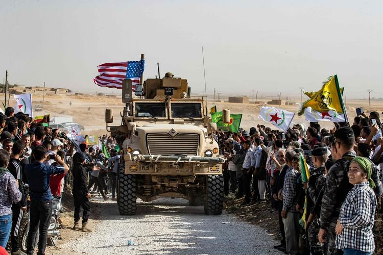 De amerikanske soldater er begyndt at trække sig tilbage fra grænseområdet i det nordøstlige Syrien. (arkivfoto)
   Foto: Delil Souleiman/Ritzau Scanpix
