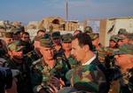 Syriens præsident, Bashar al-Assad, besøger sine tropper i Idlib i det nordvestlige Syrien. Foto: -/Ritzau Scanpix