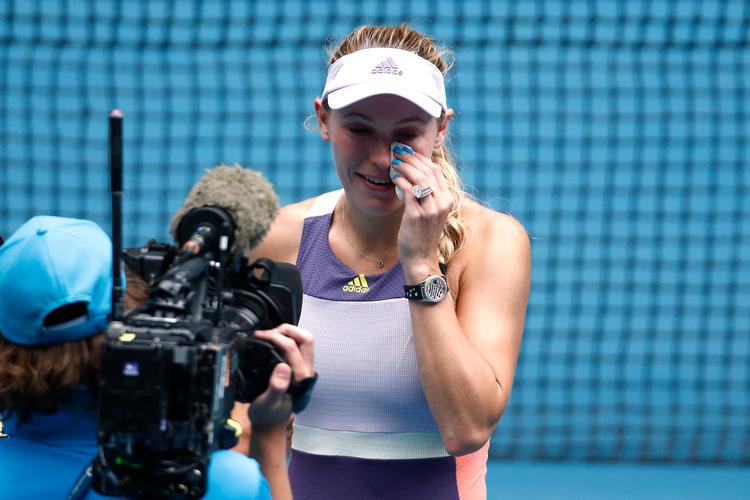 Wozniacki kunne ikke holde tårerne tilbage, da karrieerns sidste bold var slået.
   Foto: Edgar Su/Ritzau Scanpix