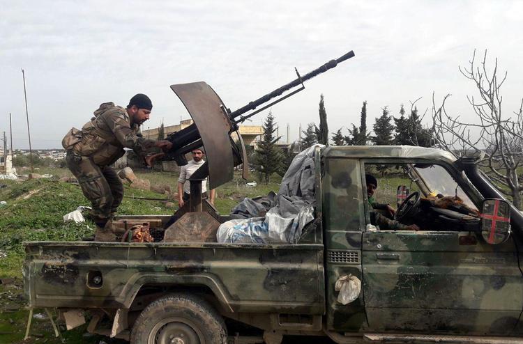 Syriske soldater fotograferet i den syriske Idlib-provins i går.  Foto: Sana/Ritzau Scanpix