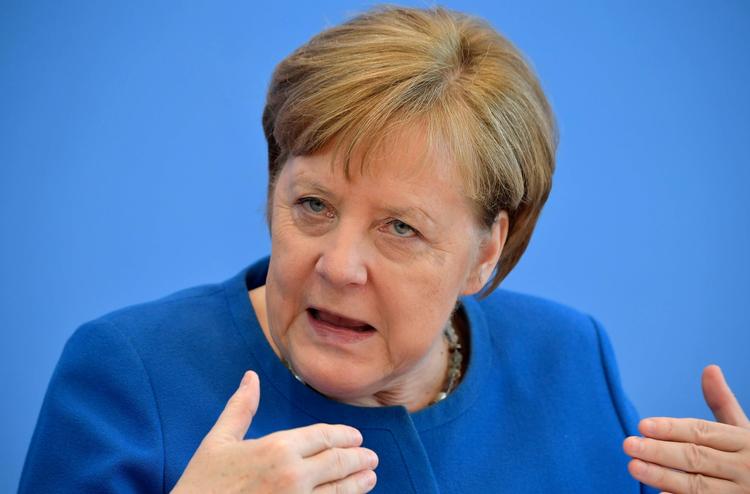 Tysklands kansler, Angela Merkel, fotograferet på dagens pressemøde, hvor hun talte om coronavirus-situationen i Tyskland.  Foto: Tobias Schwarz/Ritzau Scanpix