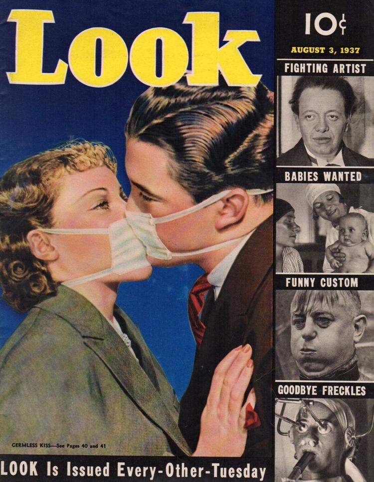 I et nummer af Look Magazine fra 1937 handlede en artikel om, hvordan skuespillere i Hollywood øvede sig i at kysse iført mundbind for at undgå at overføre bakterier.  Foto 