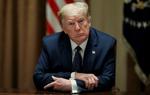 Den amerikanske præsident Donald Trump truer i et fire sider langt brev WHO med at gøre sin fastfrysning af donationer permanent, hvis ikke FN-organisationen viser, at den ikke er afhængig af Kina. Foto: Leah Millis/Ritzau Scanpix