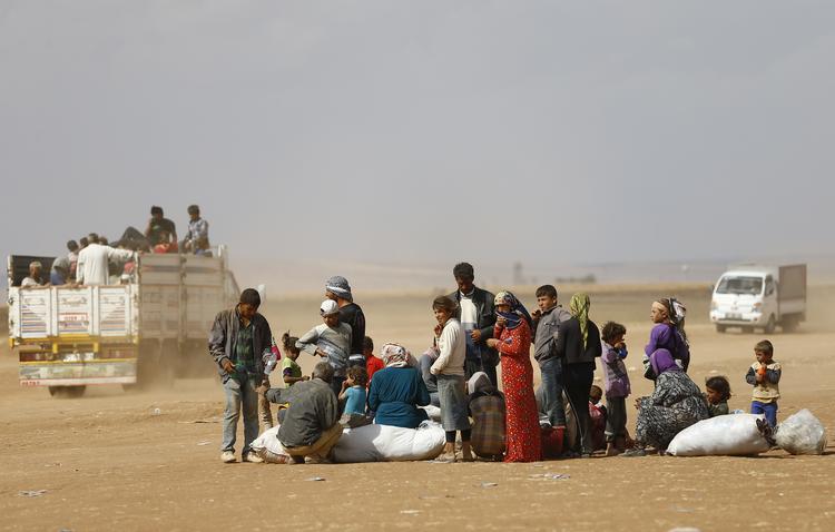     Ligesom disse kurdiske flygtninge  i 2014 forlod den 21-årige Huda Ali Ahamad og hendes 25 år ældre mand Syrien og var året efter en del af flygtningestrømmen nordpå. Nu ser det ud til, at hendes succes i Danmark og hans fiasko har kostet hende og deres søn livet.  Foto: Murad Sezer/Ritzau Scanpix