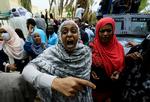 En kvinde råber slagord i forbindelse med en demonstration mod præsident Omar al-Bashir. Foto: Mohamed Nureldin Abdallah/Ritzau Scanpix