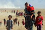 På flugt fra IS-bevæglsen i august 2014 - for nogle yazidier lykkedes det at komme væk, men tusinder af børn og unge blev tager til slaver i den 'islamiske stat' Foto: Rodi Said/Ritzau Scanpix
