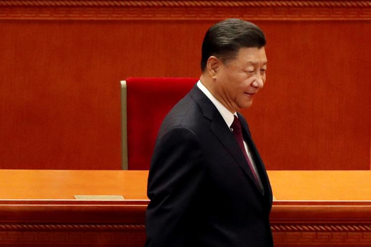 Den kinesiske præsident, Xi Jinping, satser på, at økonomisk fremgang skal få muslimske indbyggere i Xinjiang-regionen til at føle sig som en del af Kina. Foto: Carlos Garcia Rawlins/Ritzau Scanpix