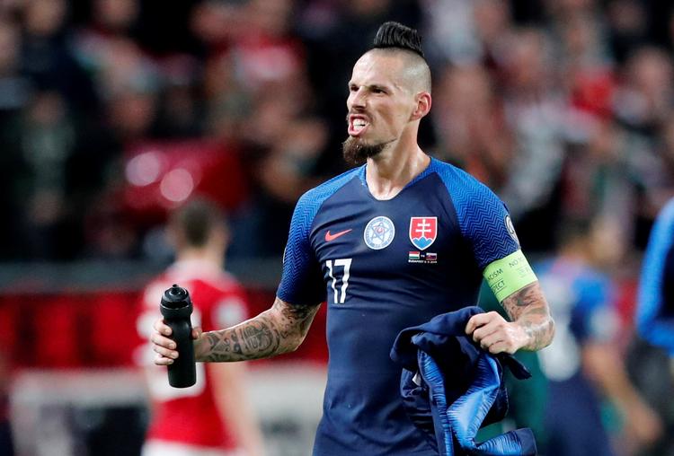 I sin rutinerede anfører Marek Hamsik har Slovakiet en spiller, der kan være guld værd på en dramatisk aften i Belfast.  Foto: Bernadett Szabo/Ritzau Scanpix