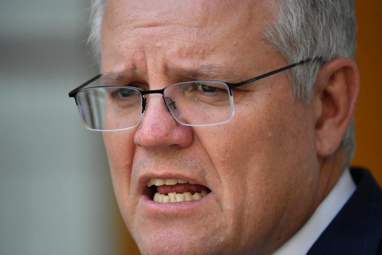     »Den kinesiske regering bør skamme sig over dette indlæg. Det gør dem små i verdens øjne, siger Australiens premierminister, Scott Morrison. Foto: Stringer/Ritzau Scanpix