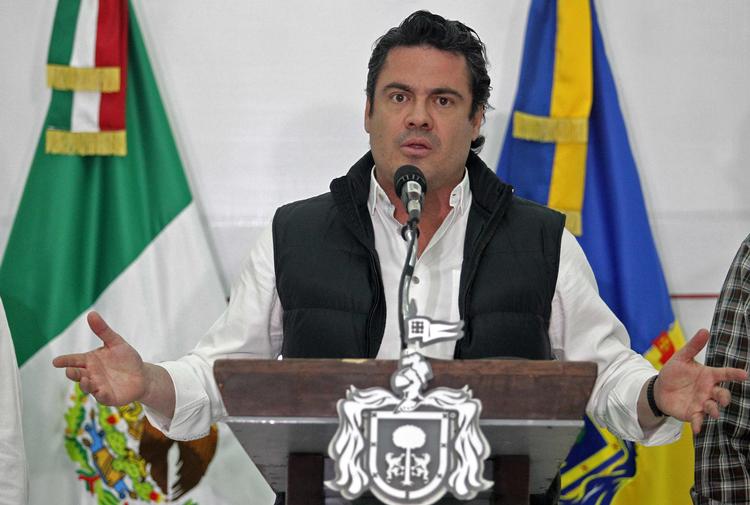 Selv om han blev ledsaget af tre livvagter, blev tidligere guvenør i Jalisco dræbt på en restaurant - formentlig af en narkobande. Foto: Ulises Ruiz/Ritzau Scanpix