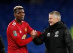 Manchester United-manager Ole Gunnar Solskjær fejrer sammen med Paul Pogba sejren over Everton i Liga Cuppen, hvor holdet i semifinalen 6. januar møder lokalrivalen Manchester City.  Foto: Clive Brunskill/Ritzau Scanpix