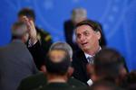 Jair Bolsonaro har under pandemien opfordret befolkningen til at ignorere krav om mundbind og afstand. Foto: Adriano Machado/Ritzau Scanpix