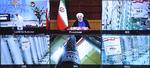 President Hasan Rouhani fremviser på en tele-konference  i Teheran nye iranske centrifuger til berigelse af uran i atomanlægget Natanz.. Dagen efter blev anlægget ramt af et cyberangreb eller en eksplosion.
. Foto: -/Ritzau Scanpix