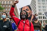 MINNEAPOLIS, MINNESOTA - MAY 23: People march during an inaugural remembrance demonstration for George Floyd on May 23, 2021 in Minneapolis, Minnesota. The National Action Network and members of George Floyd's family hosted an inaugural remembrance demonstration to honor the life of George Floyd who was killed by former Minneapolis police officer Derek Chauvin on May 25, 2020. Chauvin has since been convicted of 1 count of Second-degree murder, 1 count of Third-degree murder, and 1 count of Second-degree manslaughter. Brandon Bell/Getty Images/AFP == FOR NEWSPAPERS, INTERNET, TELCOS &amp; TELEVISION USE ONLY == Foto: Brandon Bell/Ritzau Scanpix