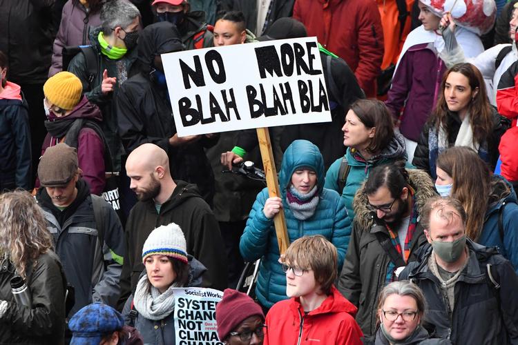 No more blah blah blah er blevet et af de mest brugte kampråb i Glasgow, men der er allerede konkrete resultater på forhandlingsbordet.  Foto: Andy Buchanan/Ritzau Scanpix