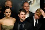 Rupert Grint (th.), Daniel Radcliffe og Emma Watson er blandt de stjerner, som deltager i 'Harry Potter'-genforeningen 1. januar 2022. Her ses de til premieren på seriens ottende og sidste film, 'Harry Potter og dødsregalierne, del 2', i 2011. Foto: Lucas Jackson/Ritzau Scanpix