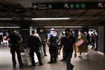 NEW YORK, NEW YORK - APRIL 12: New York City police officers stand inside Grand Central Station near a subway entrance on April 12, 2022 in New York City. Security has been heightened after a gunman in a gas mask and construction vest set off a smoke grenade and opened fire on a subway today at the 36th Street and Fourth Avenue station in the Sunset Park neighborhood of Brooklyn. At least 29 people were injured - 10 of them by gunshot - amid a fusillade of 33 rounds, according to reports. Authorities have named 62-year-old Philadelphia man Frank R. James as a person of interest. Alexi J. Rosenfeld/Getty Images/AFP == FOR NEWSPAPERS, INTERNET, TELCOS &amp; TELEVISION USE ONLY == Foto: Alexi J. Rosenfeld/Ritzau Scanpix