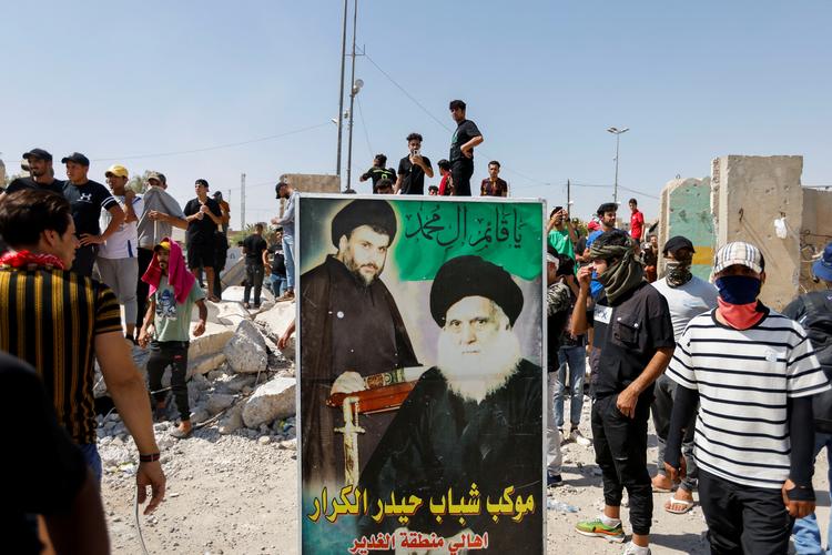 Tilhængere af Muqtada al-Sadr i Bagdads gader.
 Foto: Ahmed Saad/Ritzau Scanpix