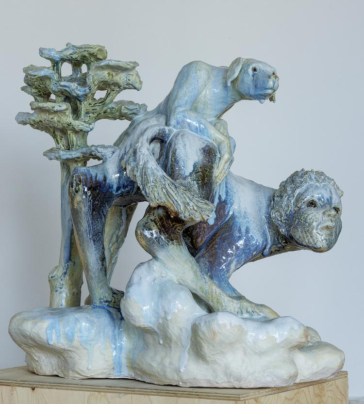 Hund og dreng er viklet ind i hinanden - og har endog byttet hoveder.  Foto: Museum Sydøstdanmark