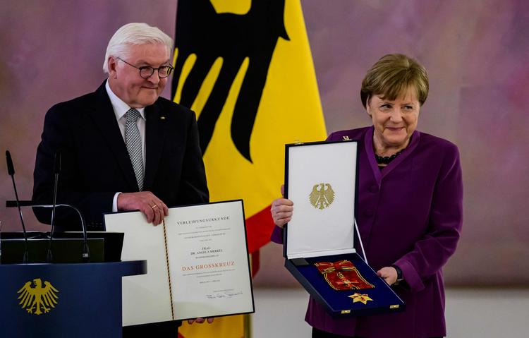 Angela Merkel sammen med Tysklands præsident, Frank-Walter Steinmeier. Foto: John Macdougall/Ritzau Scanpix