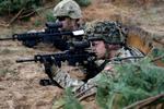 Danmark vil bruge 143 milliarder kroner på forsvaret over de næste 10 år. Men det bliver næppe det store samtaleemne op Nato-topmødet i Vilnius, vurderer en ekspert.  Her er danske soldater i Letland i forbindelse med Nato-øvelsen Silver Arrow i 2015. Foto: Ints Kalnins/Ritzau Scanpix
