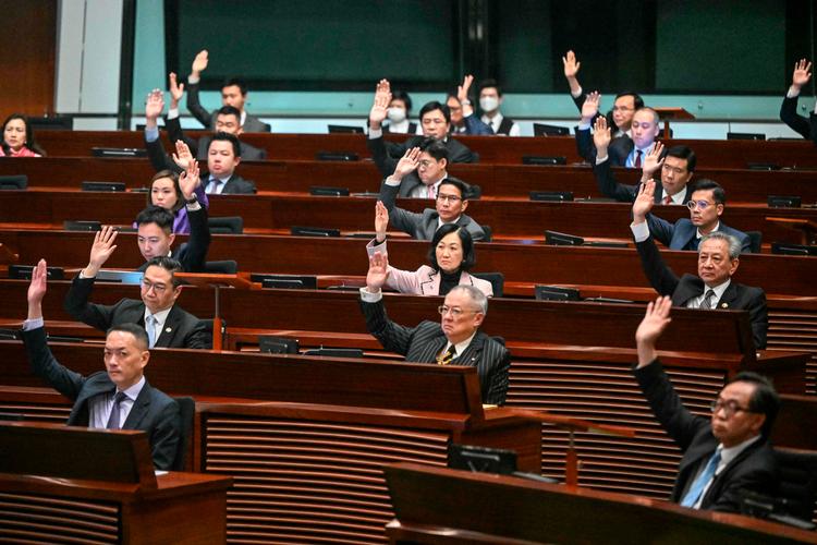 En ny lov, der bl.a. kan straffe politiske forbrydelser som tyveri af statshemmeligheder, kan få store konsekvenser for multinationale selskaber, der har kontorer i det asiatiske finanscentrum.  Foto: Peter Parks/Ritzau Scanpix