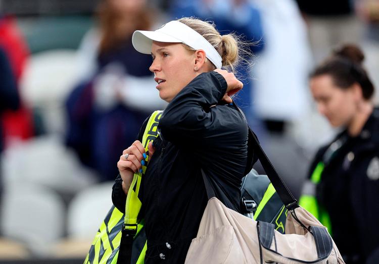 Caroline Wozniacki følte sig dårlig og trak sig til sin kamp for det kvindelige danske tennislandshold. Billedet er taget tidligere på måneden til en turnering i USA. Foto: Elsa/Ritzau Scanpix