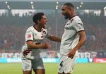 Amine Adli og Jonathan Tah fejrer 3-0-scoringen. Foto: Leon Kuegeler/Ritzau Scanpix