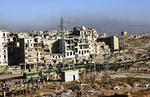 Grønne busser i Aleppo i torsdags, da Abu Tarek og hans familie kom ud med en af de første. Billedet er udsendt af det statslige syriske nyhedsbureau. 