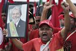 Tilhængere af den fængslede ekspræsident Lula kæmper for hans comeback. Eraldo Peres/AP