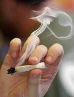 Reklamer for marihuana går ikke længere på de store sociale medier. Elaine Thompson/AP